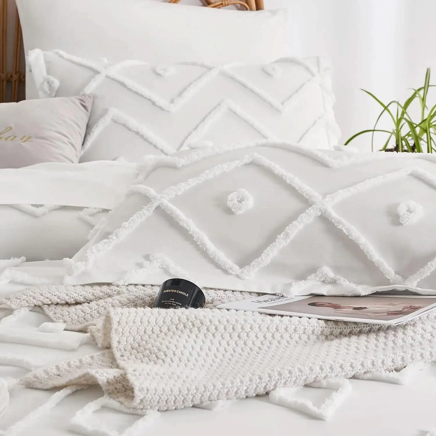 White textured blanket on a bed with pillows and a plant in the background
pinch pleat bedding set
microfiber comforter set
queen comforter set
luxury bedding
soft bedding
machine washable bedding
lightweight comforter
hotel-style bedding
gift bedding set
all-season bedding