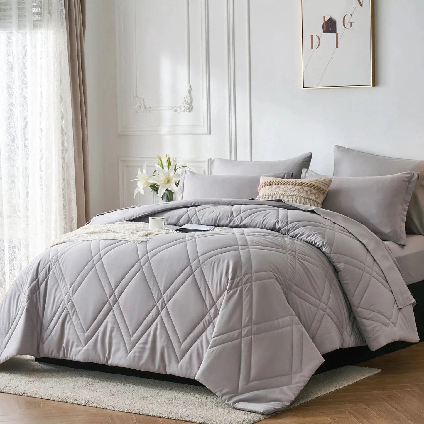 Gray quilted comforter on a bed in a well-lit bedroom
Microfiber bedding set
Queen and King bedding
Soft comforter set
Modern bedroom decor
Machine washable bedding
Polyester comforter
Cozy all-season bedding
Brushed microfiber
Lightweight and warm comforter
Bedding set with pillowcases