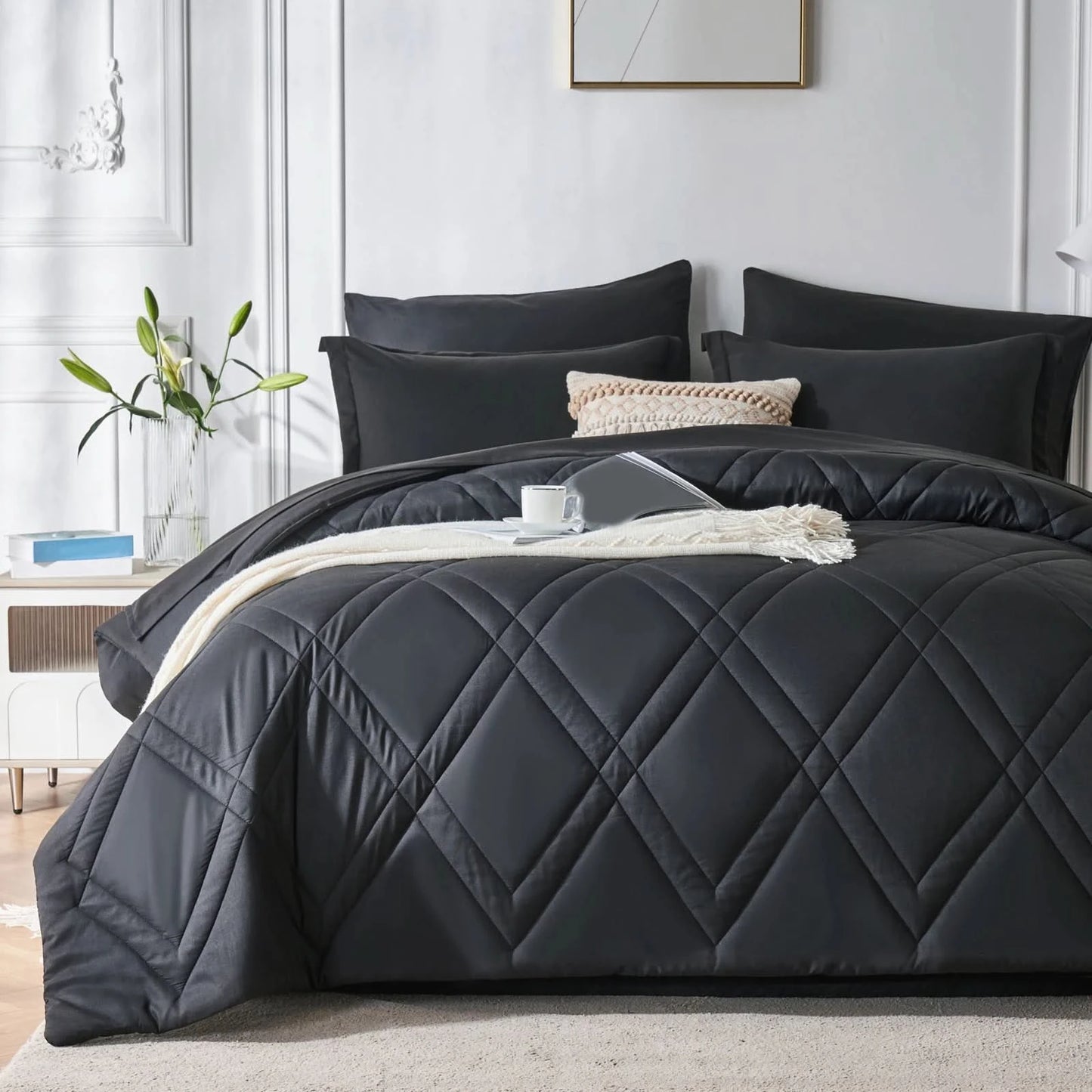 Black quilted comforter set on a bed in a bedroom with white walls and decor.
Microfiber bedding set
Queen and King bedding
Soft comforter set
Modern bedroom decor
Machine washable bedding
Polyester comforter
Cozy all-season bedding
Brushed microfiber
Lightweight and warm comforter
Bedding set with pillowcases