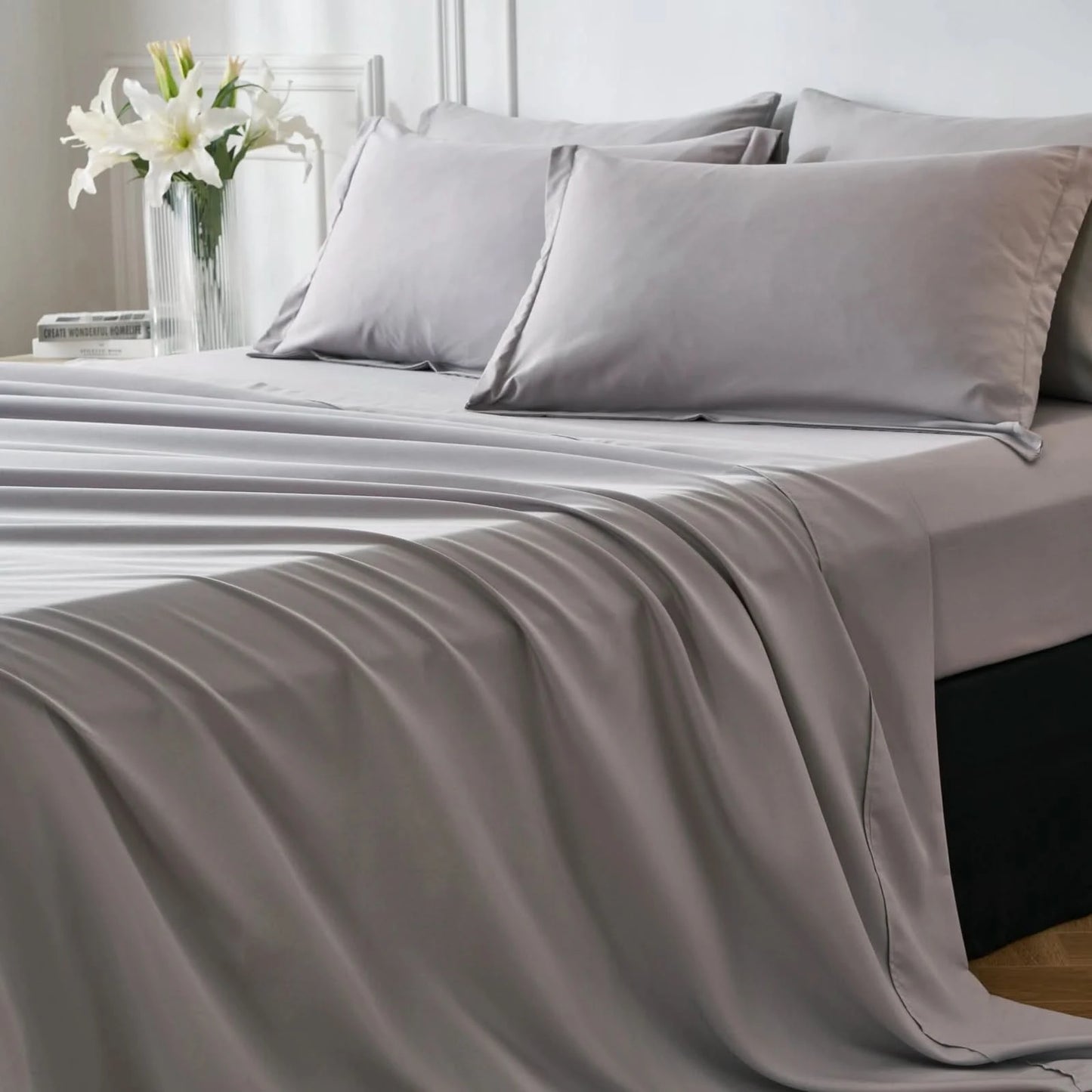 Gray bedding set on a bed with a vase of flowers in the background
Microfiber bedding set
Queen and King bedding
Soft comforter set
Modern bedroom decor
Machine washable bedding
Polyester comforter
Cozy all-season bedding
Brushed microfiber
Lightweight and warm comforter
Bedding set with pillowcases