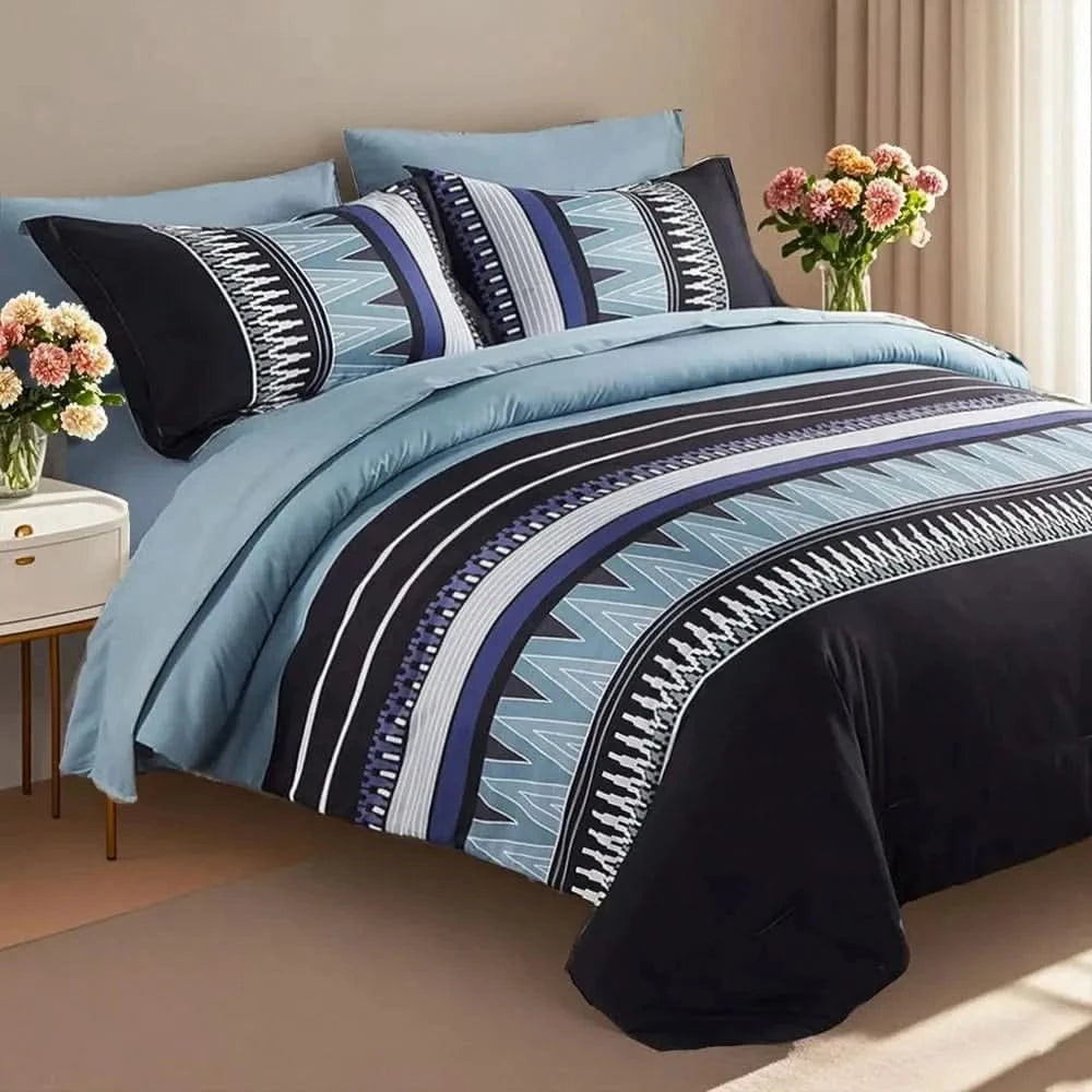 Bed with blue and black striped bedding, pillows, and flowers on a beige carpet.