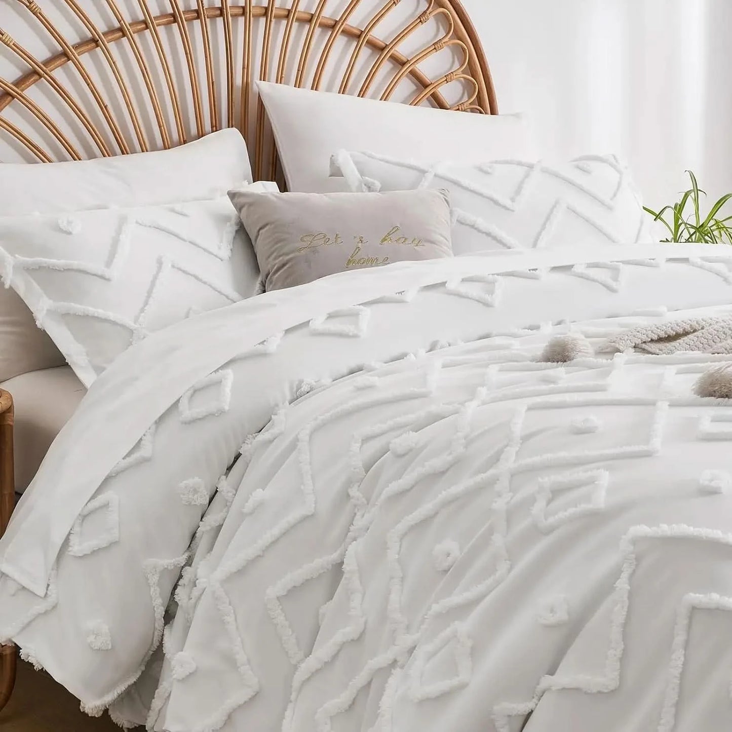 Textured white bedding set on a bed with a wicker headboard.
pinch pleat bedding set
microfiber comforter set
queen comforter set
luxury bedding
soft bedding
machine washable bedding
lightweight comforter
hotel-style bedding
gift bedding set
all-season bedding