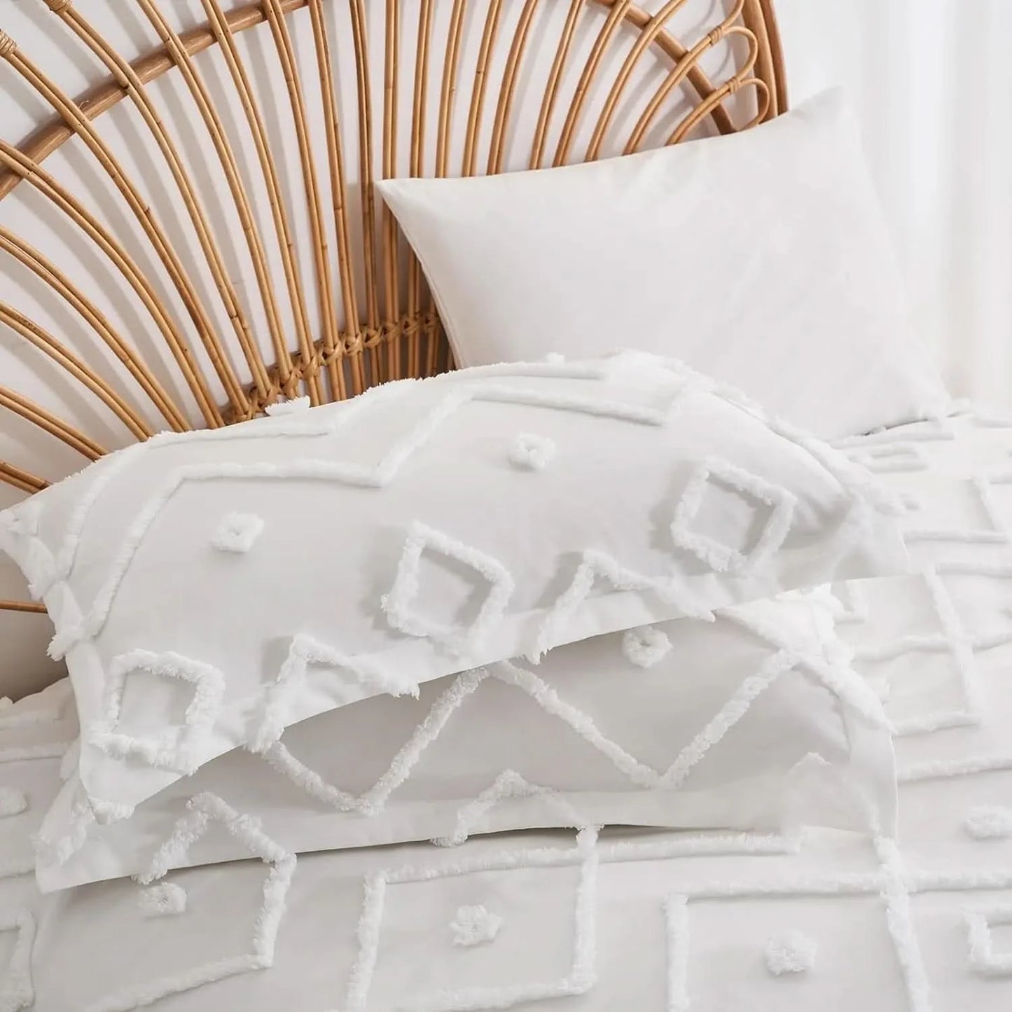 White textured bedding with geometric patterns on a bed with a wicker headboard.
pinch pleat bedding set
microfiber comforter set
queen comforter set
luxury bedding
soft bedding
machine washable bedding
lightweight comforter
hotel-style bedding
gift bedding set
all-season bedding
