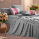Gray bedding set with patterned pillows on a bed in a bedroom setting.

7-piece microfiber bedding set

All-season bed comforter

Soft brushed microfiber bedding

Luxury quilt set for queen bed

Fade-resistant bedding set

Machine washable comforter set

Elegant bedroom decor

Gift bedding set for women

Hypoallergenic bedding