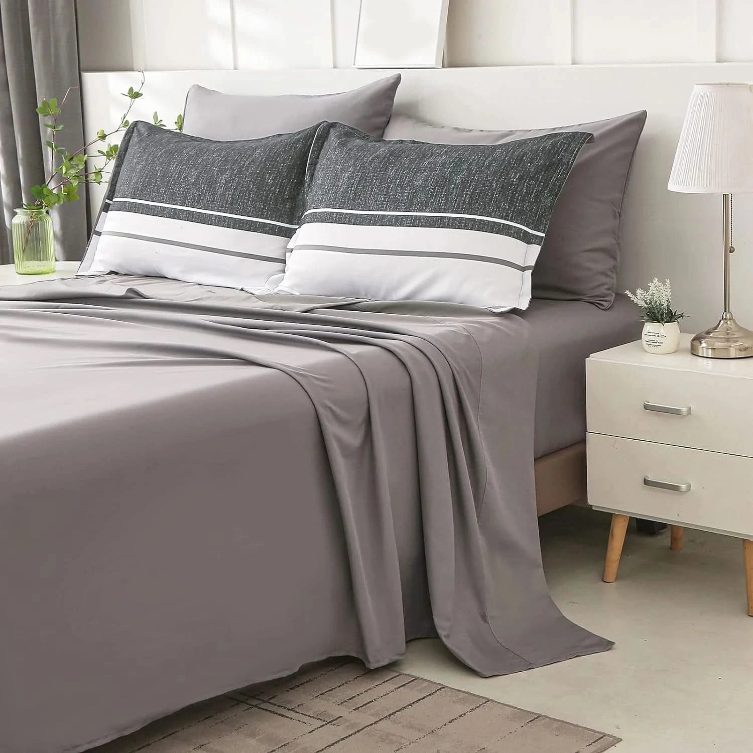Gray bedding set with striped pillows on a bed in a bedroom setting.
Comfora Cozy Bedding Set
sage green bedding
white bedding set
comforter set queen
floral duvet cover
Comfora Cozy Bedding Set
plush comforter set cozy pack
ultra-soft all-season comforter and shams
luxury cozy bedding set online
warm textured comforter set King/Queen
Green Plant Bedding
Botanical Quilt Set
Nature Print Bedding
5 Piece Bedding Set
7 Piece Bedding Set
Soft Microfiber Quilt
Breathable Bedding Set
