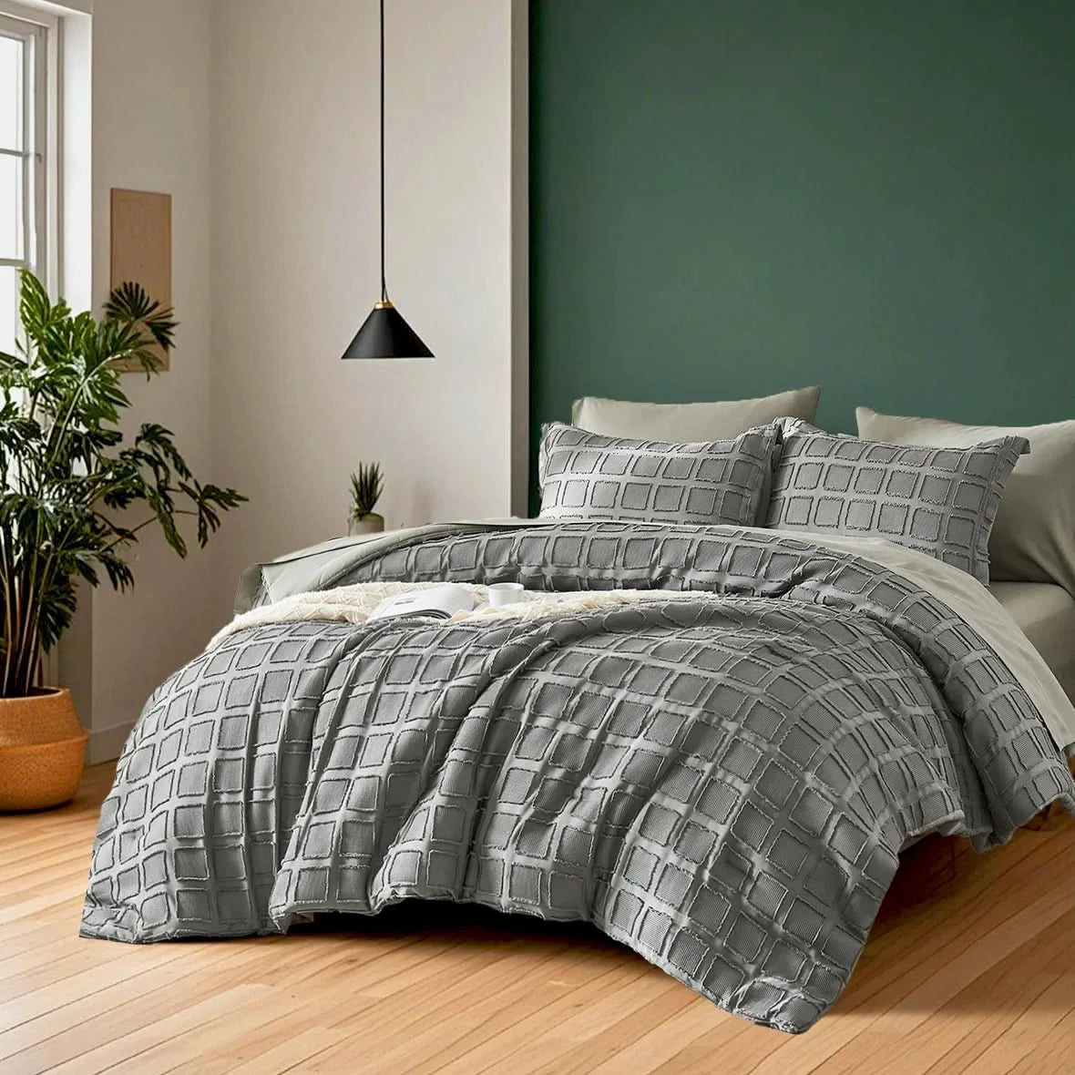 Gray checkered comforter on a bed in a bedroom with green wall and wooden floor.

Floral textured comforter

Ultra-soft microfiber comforter

Cut flower design bedding

All-season quilt set

Lightweight comforter set

Solid color bed set

Machine washable bedding

Fade-resistant bedding

Cozy bedroom gift set