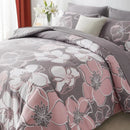 Floral patterned comforter set on a bed with pillows and a vase of flowers.
Queen floral comforter set

Large floral print bedding

7-piece microfiber bedding set

All-season comforter

Brushed microfiber comforter

Luxury bed set for queen bed

Fade-resistant bedding

Machine washable comforter

Elegant bedroom décor set

Gift bedding set for holidays