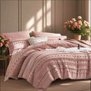 Pink textured comforter set on a bed with flowers and a bottle in the 
background
Queen size bedding set

Tufted comforter set

Microfiber bed set

Luxury bedding gift

All-season quilt set

Soft and cozy bed set

Hypoallergenic bedding

Easy care bedding

Full queen bed ensemble