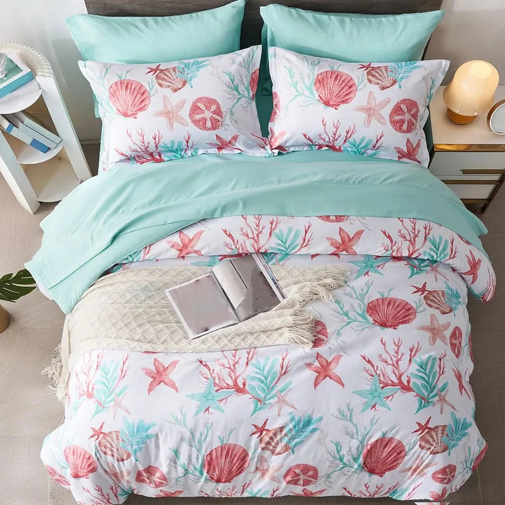 Bedding set with seashell and coral pattern on a bed with a laptop on a nightstand.
Microfiber Bedding Set, Queen Comforter Set, Lightweight Comforter, Pinch Pleat Bedding, Quilted Comforter, Solid Color Bedding, Soft Bedding Set, Elegant Bedding, All Season Comforter, Brushed Microfiber, Modern Bedroom Decor, Gift Bedding Set, Fade Resistant Bedding, Cozy Bedding Set, Hotel Style Bedding, Bedroom Essentials, Bed Comforter with Pillowcases, Non-Toxic Bedding, Machine Washable Bedding, Minimalist Bedding

