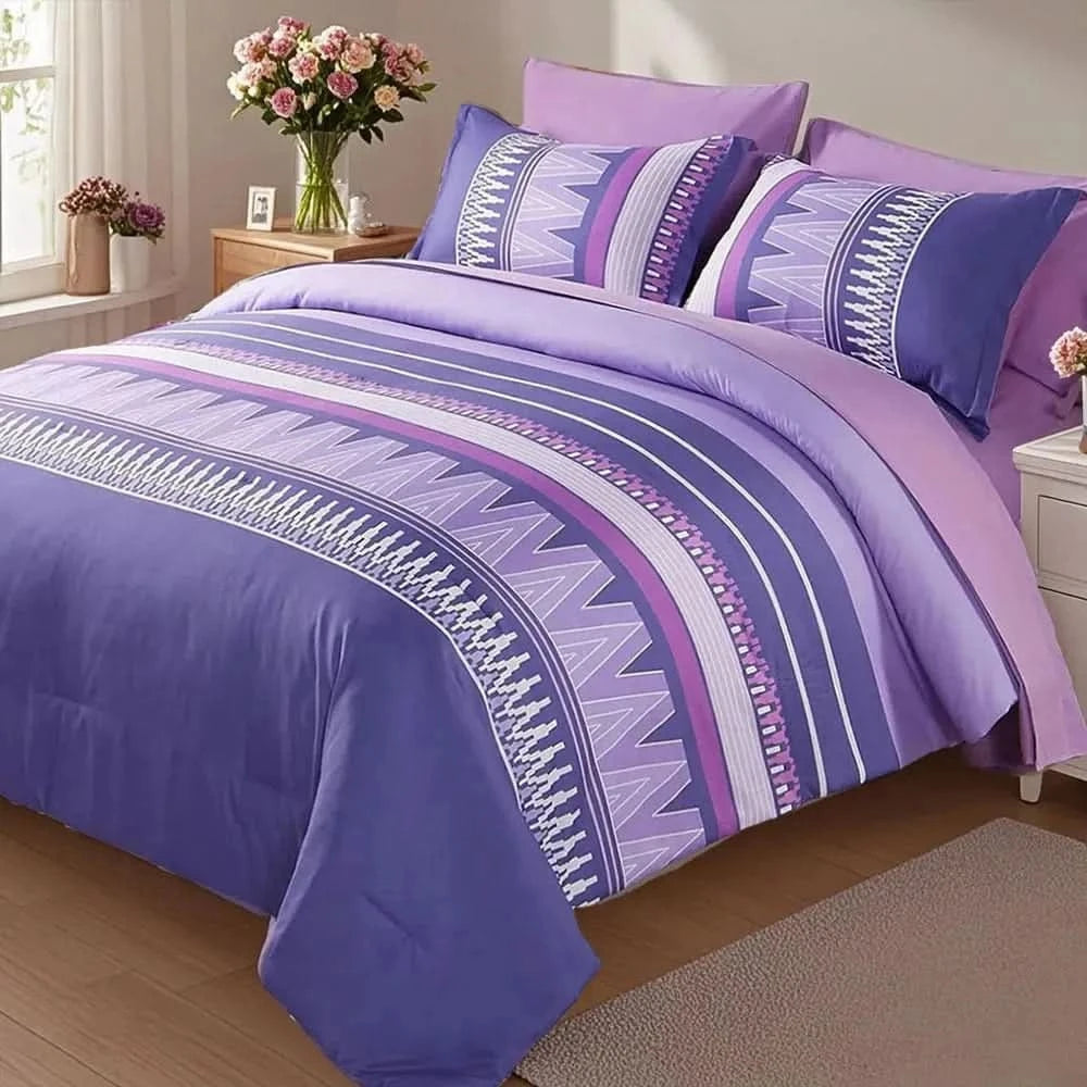 Purple and blue patterned bedding set on a bed in a bedroom with flowers and decor.
7-piece microfiber bedding set

All-season bed comforter

Soft brushed microfiber bedding

Luxury quilt set for queen bed

Fade-resistant bedding set

Machine washable comforter set

Elegant bedroom decor

Gift bedding set for women

Hypoallergenic bedding