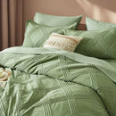 Green textured bedding set on a bed with pillows and a beige pillow.

7-piece comforter set

Brushed microfiber bedding

Ultra-soft quilt set

Lightweight comforter set

Machine washable bedding

All-season bedding set

Luxury bed set queen size

Bedding gift set

Modern bedroom decor