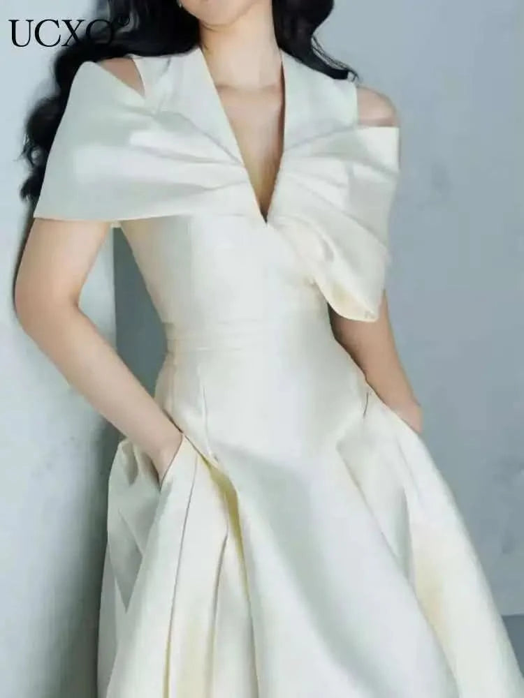 UCXQ Elegant Long Dress Fairy Style V-neck Hollow Waist 3D Bow Pocket Fashion Party Dresses For Women 2025 Spring Summer 23A9338 - M & M Global