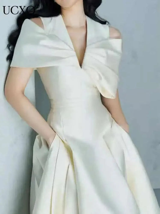 UCXQ Elegant Long Dress Fairy Style V-neck Hollow Waist 3D Bow Pocket Fashion Party Dresses For Women 2025 Spring Summer 23A9338 - M & M Global