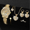 Women's gold quartz watch and jewelry set with rhinestones, featuring a watch, ring, necklace, and earrings on a black background.