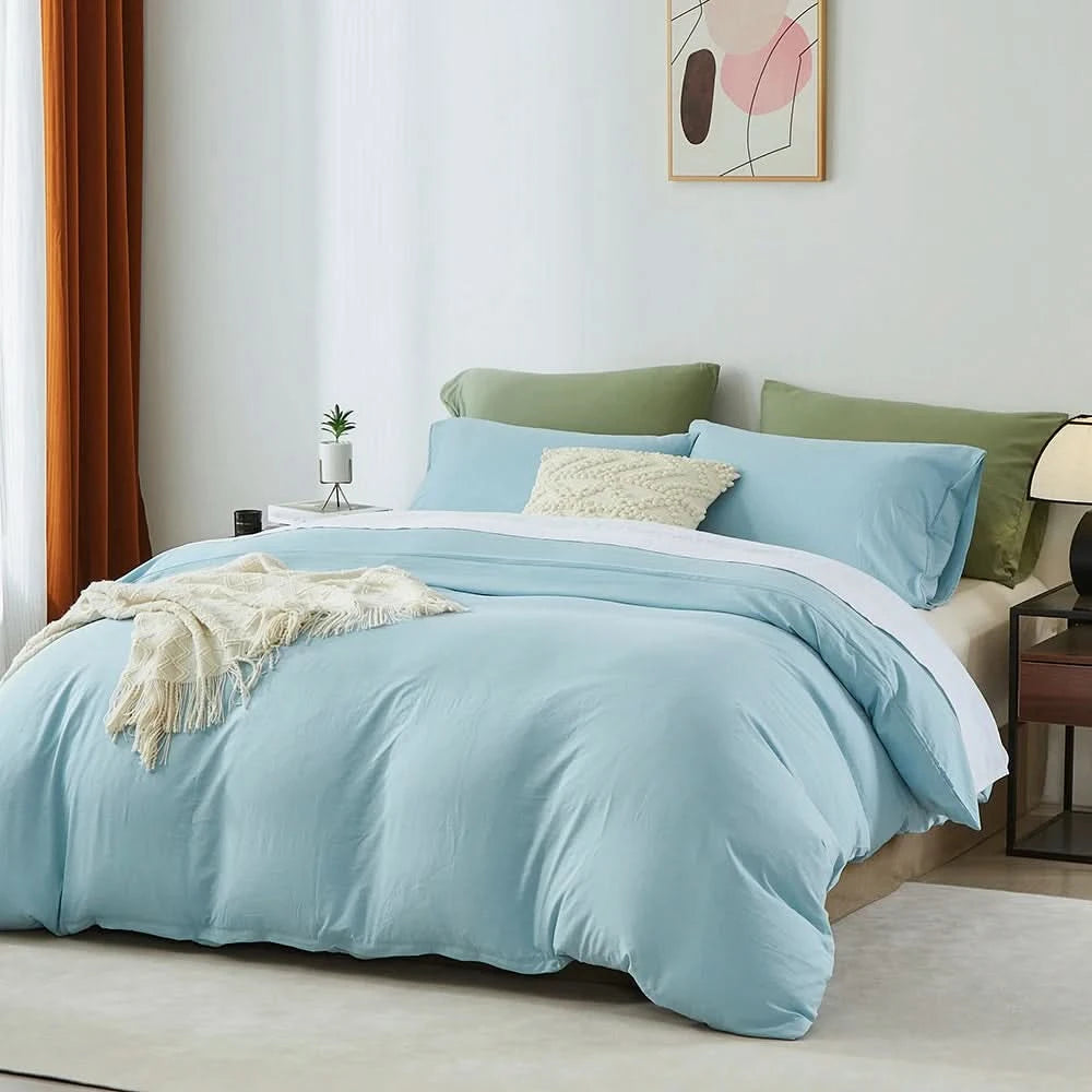 Bed with light blue bedding and green pillows in a room with a lamp and plant.
Microfiber Bedding Set, Queen Comforter Set, Lightweight Comforter, Pinch Pleat Bedding, Quilted Comforter, Solid Color Bedding, Soft Bedding Set, Elegant Bedding, All Season Comforter, Brushed Microfiber, Modern Bedroom Decor, Gift Bedding Set, Fade Resistant Bedding, Cozy Bedding Set, Hotel Style Bedding, Bedroom Essentials, Bed Comforter with Pillowcases, Non-Toxic Bedding, Machine Washable Bedding, Minimalist Bedding
