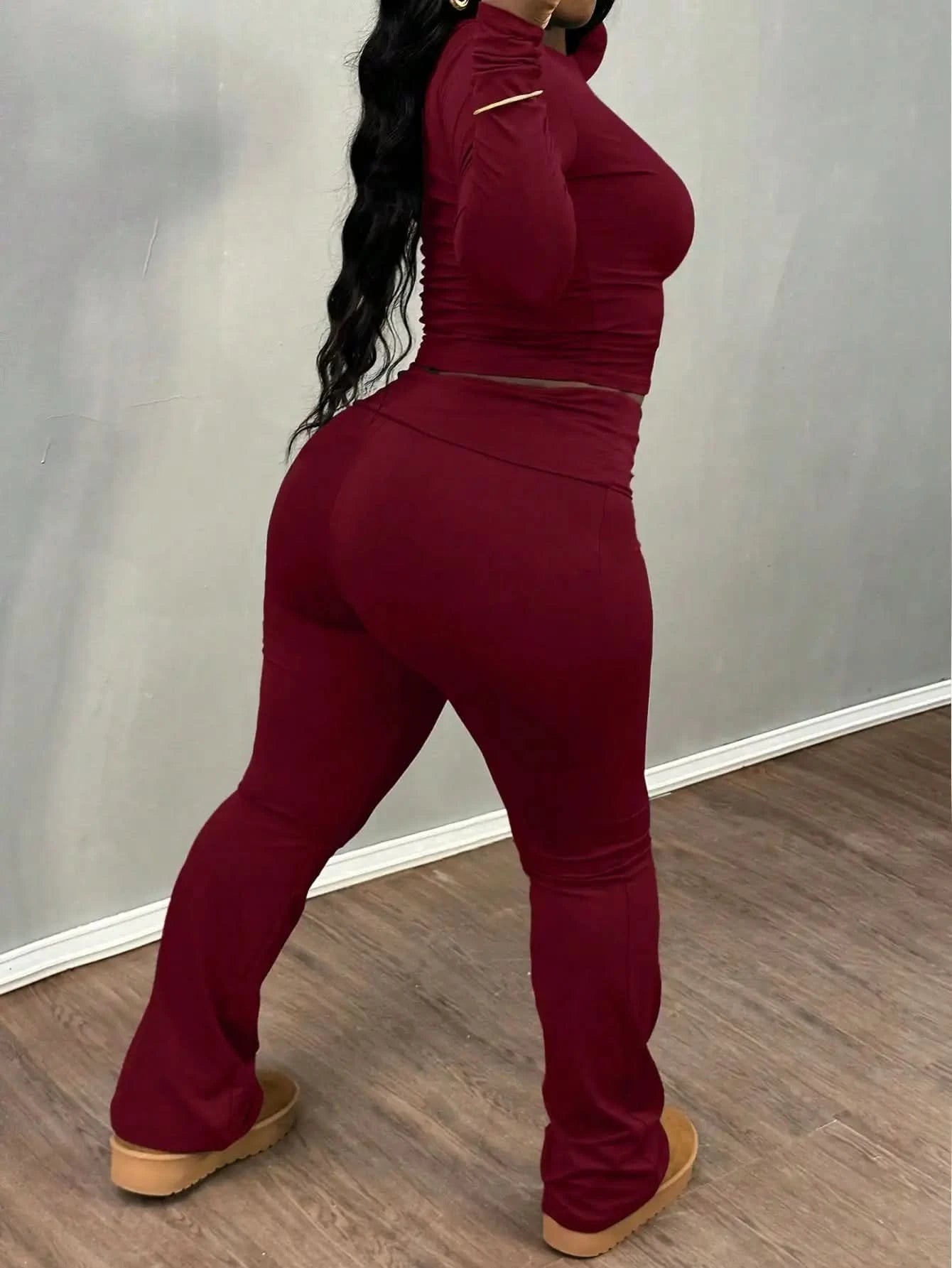 A Wine Red Long-sleeved Crop Top and Flared Pants Collection for Women - A Fashionable and Comfortable Sportswear Set for Ladies
