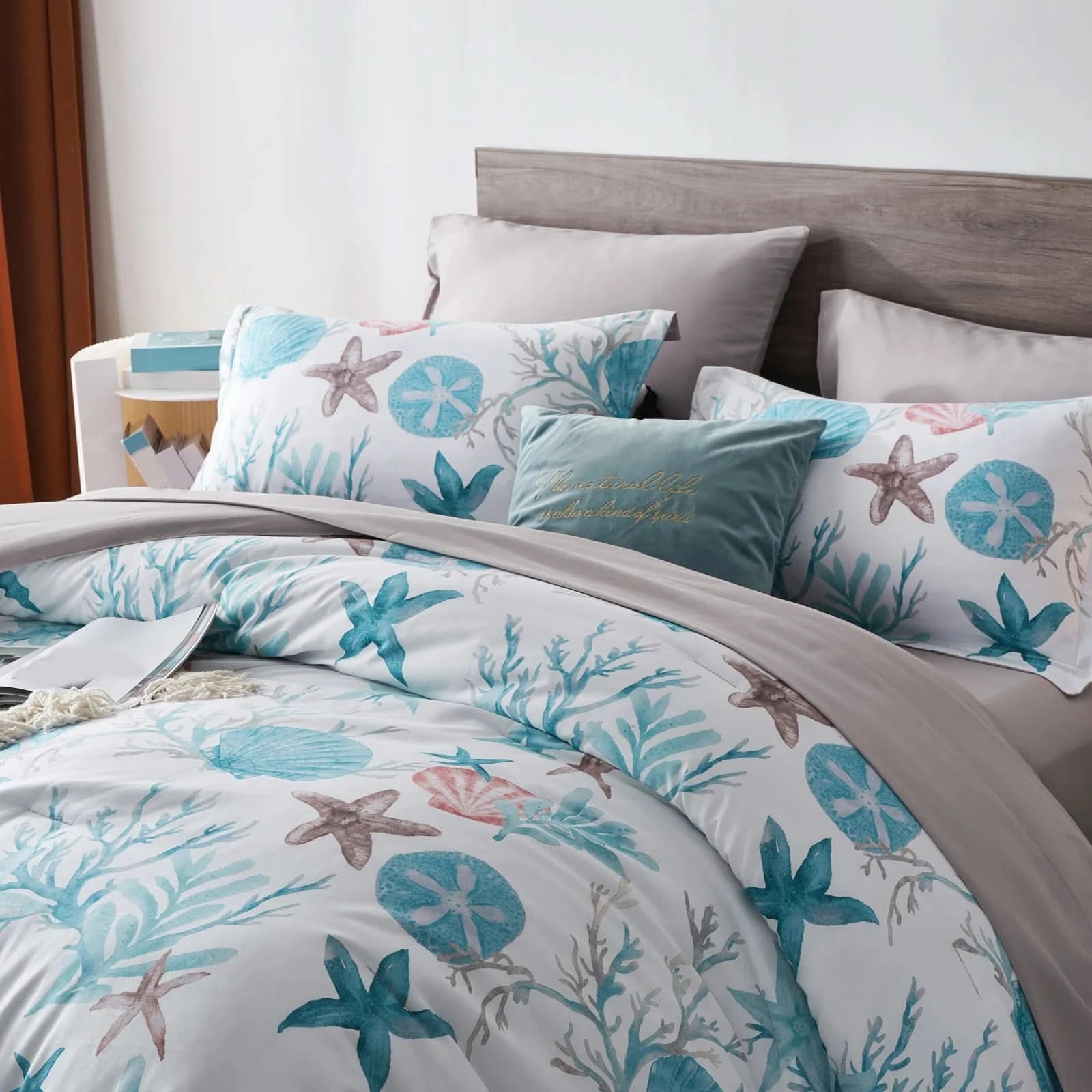Bed with beach-themed bedding featuring starfish and sand dollar 
patterns.
Microfiber Bedding Set, Queen Comforter Set, Lightweight Comforter, Pinch Pleat Bedding, Quilted Comforter, Solid Color Bedding, Soft Bedding Set, Elegant Bedding, All Season Comforter, Brushed Microfiber, Modern Bedroom Decor, Gift Bedding Set, Fade Resistant Bedding, Cozy Bedding Set, Hotel Style Bedding, Bedroom Essentials, Bed Comforter with Pillowcases, Non-Toxic Bedding, Machine Washable Bedding, Minimalist Bedding
