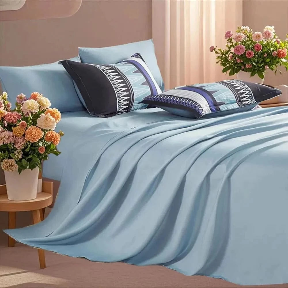Blue bedding set with decorative pillows and flowers in a bedroom 
7-piece microfiber bedding set

All-season bed comforter

Soft brushed microfiber bedding

Luxury quilt set for queen bed

Fade-resistant bedding set

Machine washable comforter set

Elegant bedroom decor

Gift bedding set for women

Hypoallergenic beddingsetting