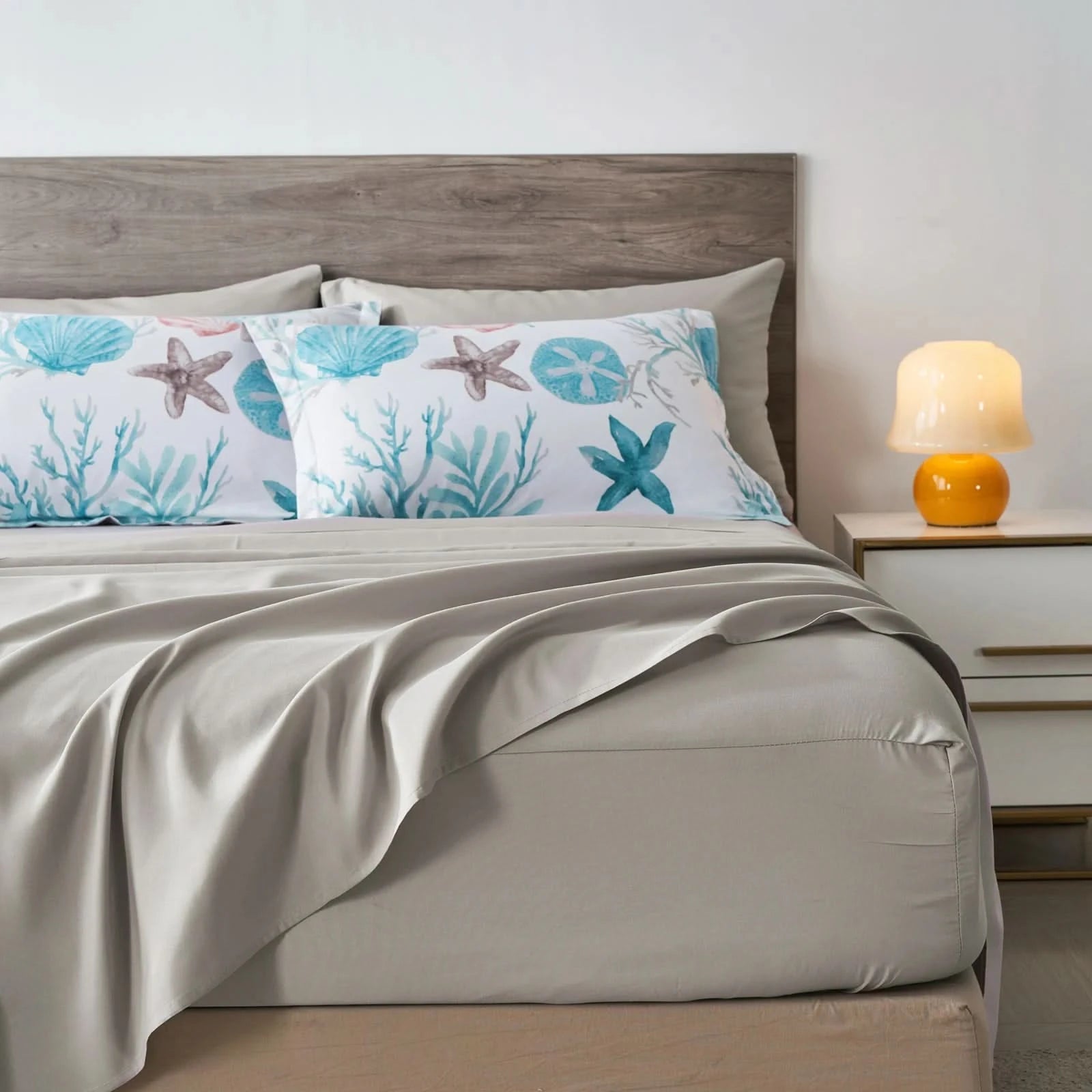 Bed with decorative pillows featuring starfish and coral patterns, next to a nightstand with a lamp.
Microfiber Bedding Set, Queen Comforter Set, Lightweight Comforter, Pinch Pleat Bedding, Quilted Comforter, Solid Color Bedding, Soft Bedding Set, Elegant Bedding, All Season Comforter, Brushed Microfiber, Modern Bedroom Decor, Gift Bedding Set, Fade Resistant Bedding, Cozy Bedding Set, Hotel Style Bedding, Bedroom Essentials, Bed Comforter with Pillowcases, Non-Toxic Bedding, Machine Washable Bedding, Minim