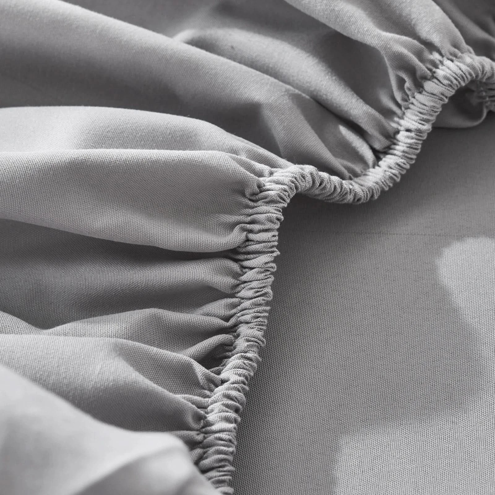 Close-up of a gray fitted sheet with ruffled edges on a bed.
Microfiber bedding set

Queen and King bedding

Soft comforter set

Modern bedroom decor

Machine washable bedding

Polyester comforter

Cozy all-season bedding

Brushed microfiber

Lightweight and warm comforter

Bedding set with pillowcases